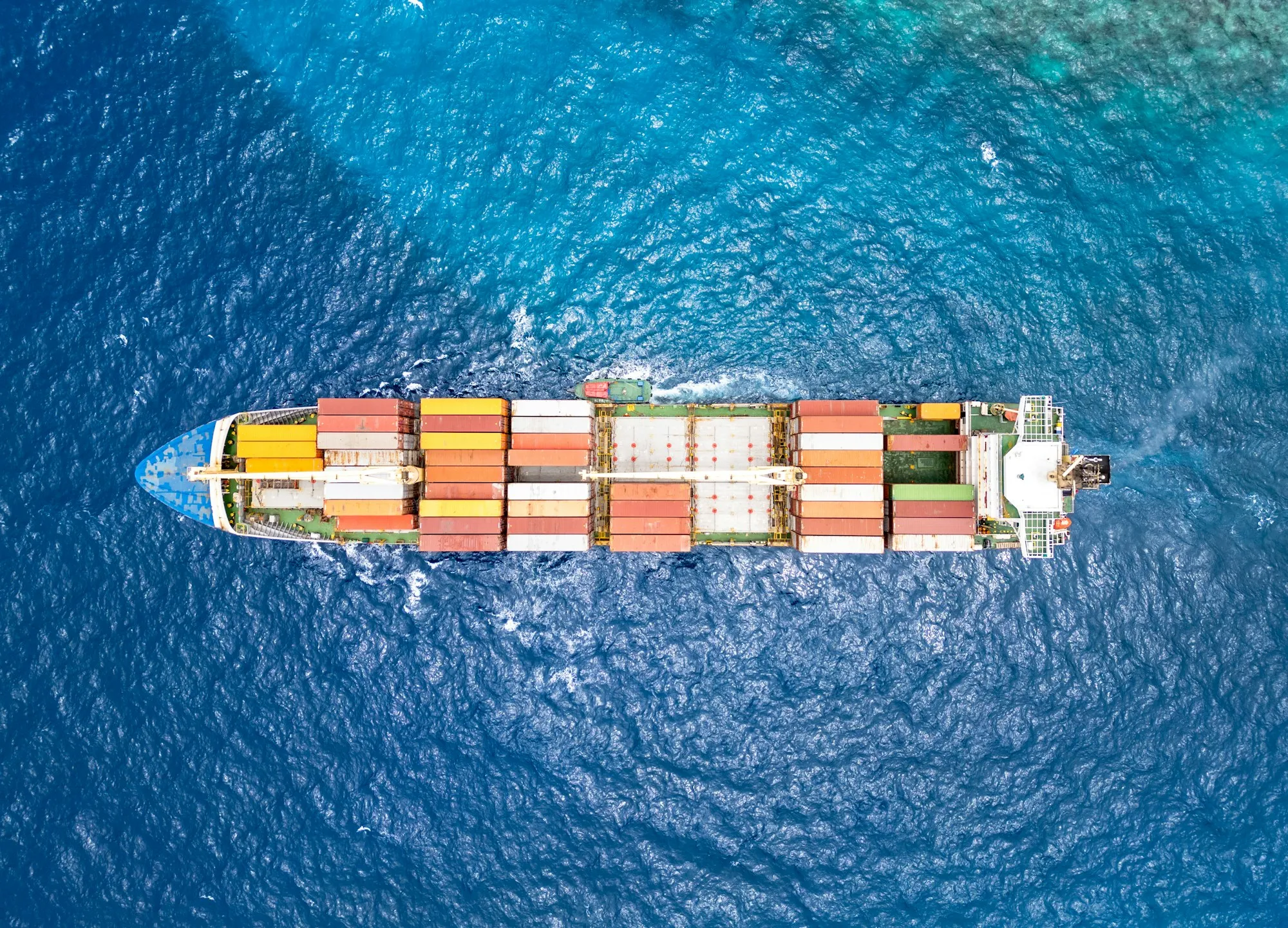 Aerial view of a fully loaded container vessel crossing the ocean — ANJUN ocean freight from China to North America